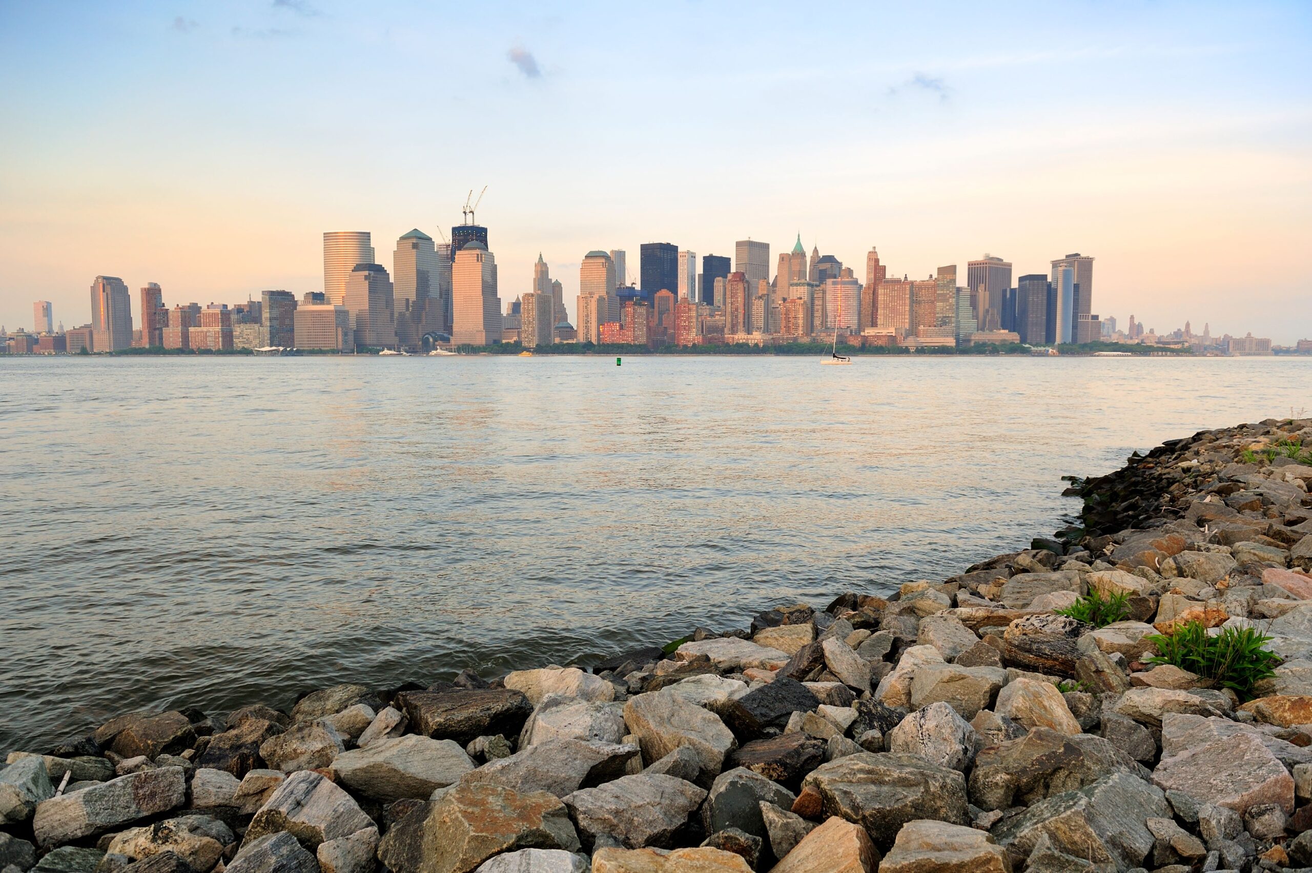 A View on Bronx From the Rocky Beach Across the Body of Water