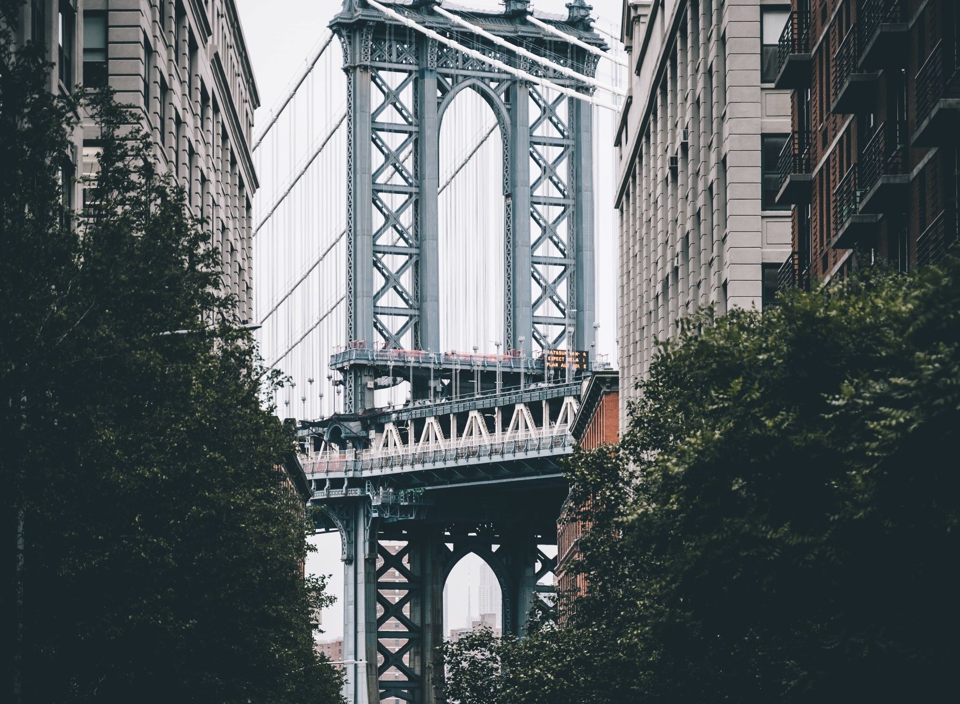 Manhattan Bridge on a Cloudy Day Surrounded by Trees