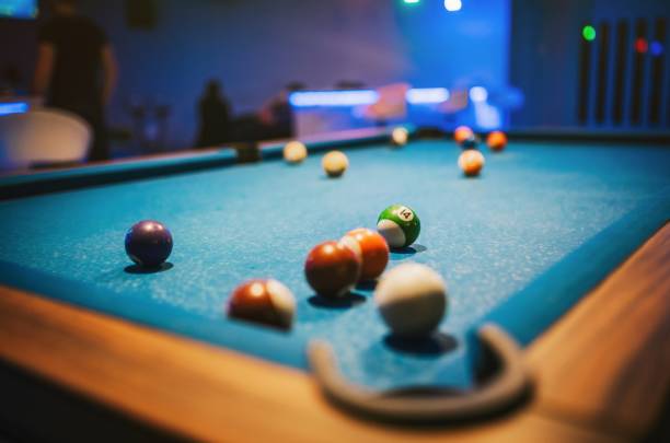 Blue Pool Table and Billiard Balls.