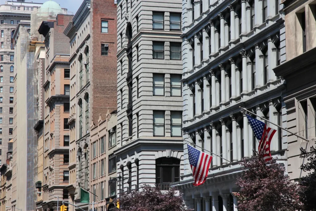 Close up Photo of Lenox Hill Apartment Buildings with Focus to the American Flags